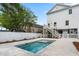This backyard features a private pool, fenced yard, a back porch, and a concrete patio at 135A Sunset Dr., Murrells Inlet, SC 29576