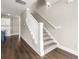 An inviting staircase with carpeted steps and white railings creates a seamless transition between floors at 135A Sunset Dr., Murrells Inlet, SC 29576