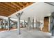 Underneath the house reveals pilings, cross beams, and a concrete patio at 135A Sunset Dr., Murrells Inlet, SC 29576