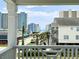 Scenic balcony view overlooking charming beach houses, palm trees, and the ocean at 135B Sunset Dr., Murrells Inlet, SC 29576
