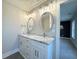 Elegant bathroom with double vanity, marble countertops, and stylish lighting fixtures at 135B Sunset Dr., Murrells Inlet, SC 29576