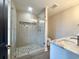 Modern bathroom featuring a glass-enclosed shower with stone accents and stylish vanity at 135B Sunset Dr., Murrells Inlet, SC 29576