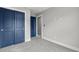 Bedroom featuring neutral walls with bright blue closet and passage doors at 135B Sunset Dr., Murrells Inlet, SC 29576