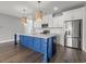 Modern kitchen featuring bright white cabinets, sleek countertops, stainless steel appliances and a large island at 135B Sunset Dr., Murrells Inlet, SC 29576