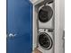 Modern stacked washer and dryer with a blue door at 135B Sunset Dr., Murrells Inlet, SC 29576