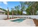 Swimming pool with a white fence and sparse landscaping under a blue sky at 135B Sunset Dr., Murrells Inlet, SC 29576