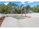 In-ground swimming pool with sparse landscaping and a white fence around the perimeter at 135B Sunset Dr., Murrells Inlet, SC 29576