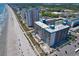 Stunning aerial view of the oceanfront resort, showcasing the beach, pools, and modern high-rise buildings at 1501 S Ocean Blvd. # 1422, Myrtle Beach, SC 29577
