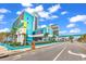 Beautiful Landmark Resort exterior with a blue and white facade, lush landscaping, and a vibrant coastal setting at 1501 S Ocean Blvd. # 1422, Myrtle Beach, SC 29577