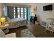 Relaxing bedroom with patio doors, a fireplace, and a comfortable bed at 1600 Ocean Blvd. S # 204, Myrtle Beach, SC 29577