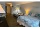 Comfortable bedroom featuring a full bed and a view into the hall at 1600 Ocean Blvd. S # 204, Myrtle Beach, SC 29577