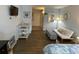Open living area with a futon, table and shelving, and a view of the entryway at 1600 Ocean Blvd. S # 204, Myrtle Beach, SC 29577