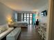 Comfortable living room with balcony access and space to relax at 1600 Ocean Blvd. S # 204, Myrtle Beach, SC 29577