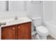 Bathroom showcasing a white sink and vanity with wood cabinets, a toilet, and tub/shower combo at 1636 Stuart Square Circle, Myrtle Beach, SC 29577