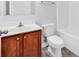 Bathroom showcasing a white sink and vanity with wood cabinets, a toilet, and tub/shower combo at 1636 Stuart Square Circle, Myrtle Beach, SC 29577