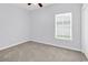Bright bedroom with neutral carpet, light gray walls, and a window providing natural light at 1636 Stuart Square Circle, Myrtle Beach, SC 29577