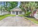 Charming single-story home featuring a well-manicured lawn, symmetrical design, and welcoming front porch at 1636 Stuart Square Circle, Myrtle Beach, SC 29577