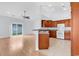 Open-concept living room and kitchen area with vaulted ceilings and abundant natural light at 1636 Stuart Square Circle, Myrtle Beach, SC 29577