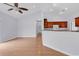 Bright living room with hardwood floors, high ceiling with fan, open to the kitchen area at 1636 Stuart Square Circle, Myrtle Beach, SC 29577