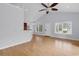 Bright living room with hardwood floors, high ceiling with fan, windows for natural light at 1636 Stuart Square Circle, Myrtle Beach, SC 29577