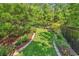 Serene backyard featuring a charming swing surrounded by lush landscaping and a fence at 1662 Westminster Dr., Myrtle Beach, SC 29577