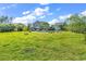 Expansive backyard featuring a pool, patio area, and well-maintained lawn at 1662 Westminster Dr., Myrtle Beach, SC 29577