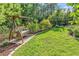 Backyard featuring a covered swing with cushions, surrounded by lush landscaping and a fence at 1662 Westminster Dr., Myrtle Beach, SC 29577