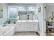Well-lit bathroom with double vanity, soaking tub, and modern fixtures at 1662 Westminster Dr., Myrtle Beach, SC 29577