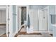 Bathroom featuring a tiled shower, patterned accent wall, and elegant fixtures at 1662 Westminster Dr., Myrtle Beach, SC 29577