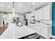 Modern kitchen with white cabinets, large island, stainless steel appliances, and hardwood floors at 1662 Westminster Dr., Myrtle Beach, SC 29577