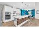 Modern kitchen with white cabinets, large island, stainless steel appliances, and hardwood floors at 1662 Westminster Dr., Myrtle Beach, SC 29577