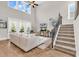 Open-concept living room featuring high ceilings, large windows, and staircase with iron railing at 1662 Westminster Dr., Myrtle Beach, SC 29577