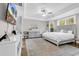 Spacious main bedroom with tray ceiling, large windows, decorative fireplace, and elegant decor at 1662 Westminster Dr., Myrtle Beach, SC 29577