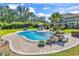 Beautiful backyard pool featuring a rock waterfall, lounge chairs and a lovely patio area at 1662 Westminster Dr., Myrtle Beach, SC 29577