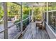 Screened porch featuring wood floors, a wicker couch, and views of the surrounding greenery at 1662 Westminster Dr., Myrtle Beach, SC 29577