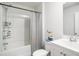 Standard bathroom featuring a shower-tub combo with toiletry shelves and a white vanity sink at 1807 Berkley Village Loop, Myrtle Beach, SC 29579