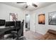 A well-lit bedroom features a ceiling fan and wall decor, complemented by a comfortable desk setup at 1807 Berkley Village Loop, Myrtle Beach, SC 29579