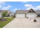 Charming home featuring a two-car garage and well-manicured lawn, offering great curb appeal at 1807 Berkley Village Loop, Myrtle Beach, SC 29579