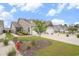 A cozy home with a manicured lawn, featuring a two-car garage and attractive landscaping at 1807 Berkley Village Loop, Myrtle Beach, SC 29579