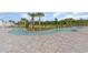 Relaxing lazy river with stone-paved surrounding, palm trees, and manicured greenery at 1807 Berkley Village Loop, Myrtle Beach, SC 29579