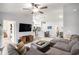 Open-concept living area with modern decor, stylish sectional sofa, and seamless flow to the kitchen at 1807 Berkley Village Loop, Myrtle Beach, SC 29579