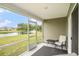 Screened patio with comfortable seating offers serene views of the pond and fountain at 1807 Berkley Village Loop, Myrtle Beach, SC 29579