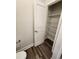 Bathroom with a walk-in closet featuring a door and shelving for ample storage at 181 Norris Ln, Loris, SC 29569