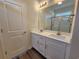 Modern bathroom featuring double sink vanity with white cabinetry and large mirror at 181 Norris Ln, Loris, SC 29569
