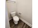 Cozy half bathroom features wood-look floors, white fixtures, and neutral paint at 181 Norris Ln, Loris, SC 29569