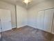 Bedroom with carpeted flooring, neutral walls, ceiling fan and closet at 181 Norris Ln, Loris, SC 29569