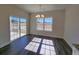 Bright dining room with sliding glass door and large window overlooking the backyard at 181 Norris Ln, Loris, SC 29569