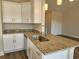 Modern kitchen with granite countertops, stainless steel appliances, and white cabinetry at 181 Norris Ln, Loris, SC 29569