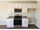 Well-equipped kitchen with stainless steel microwave and oven, and ample counter space at 181 Norris Ln, Loris, SC 29569