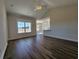 Bright and spacious living room with wood flooring and an open layout to the kitchen at 181 Norris Ln, Loris, SC 29569